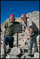 Father and son standing next to Bishop Pass sign. Kings Canyon National Park, California