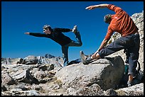 Hikers doing stretching exercises, Bishop Pass. Kings Canyon National Park, California