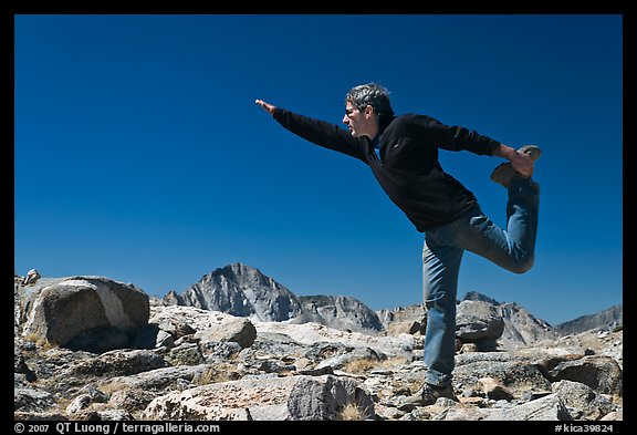 Hiker stretching, Bishop Pass. Kings Canyon National Park, California (color)