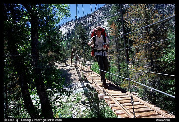 Crossing a river on a suspension footbridge. Kings Canyon National Park, California