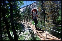 Crossing a river on a suspension footbridge. Kings Canyon National Park, California