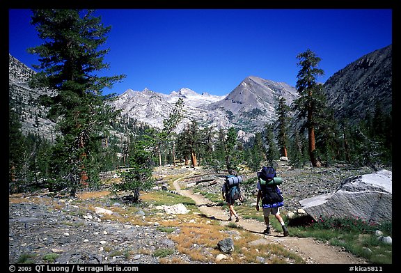 Backpackers in valley near Rae Lakes, Kings Canyon National Park. California (color)