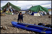 Inflating the canoe next to an Eskimo fish camp in Ambler. Kobuk Valley National Park, Alaska