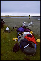 Gear laid out for drying on the bottom of the canoe on a small island of the Kobuk River. Kobuk Valley National Park, Alaska (color)