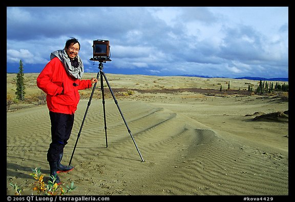 Large format photographer QT Luong with camera on Kobuk Dunes. Kobuk Valley National Park, Alaska