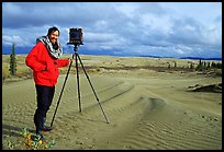 Large format photographer QT Luong with camera on Kobuk Dunes. Kobuk Valley National Park, Alaska