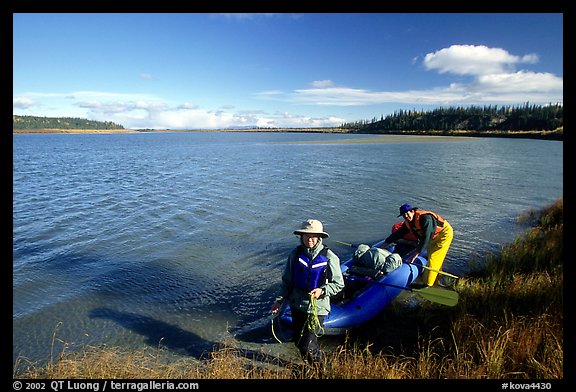 Canoeist with inflatable canoe on the shores of Kobuk River. Kobuk Valley National Park, Alaska