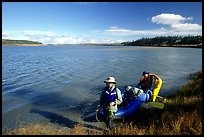 Canoeist with inflatable canoe on the shores of Kobuk River. Kobuk Valley National Park, Alaska