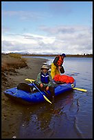 Canoeists finish  loading  with the boat prior to launching. Kobuk Valley National Park, Alaska