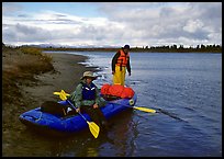 Canoeists ready to lauch with the boat loaded up. Kobuk Valley National Park, Alaska (color)