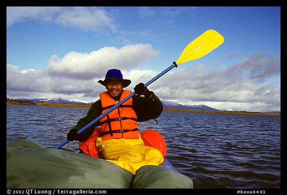 Canoeist Paddling on the Kobuk River. Kobuk Valley National Park, Alaska (color)