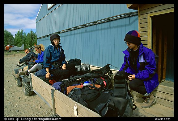 Riding on the trailer with the gear. Lake Clark National Park, Alaska (color)