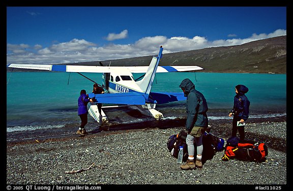 Backpackers dropped off by floatplane on Lake Turquoise. Lake Clark National Park, Alaska (color)
