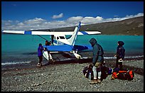 Backpackers dropped off by floatplane on Lake Turquoise. Lake Clark National Park, Alaska (color)