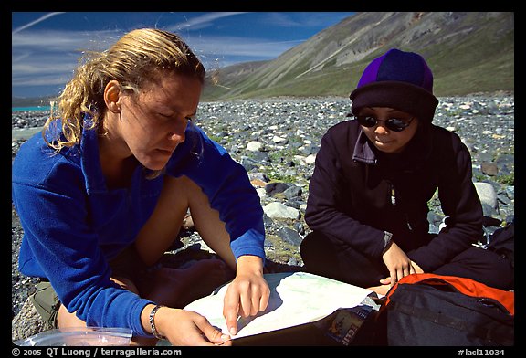 Women hikers consulting a map. Lake Clark National Park, Alaska (color)