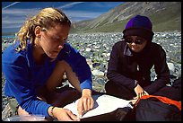 Women hikers consulting a map. Lake Clark National Park, Alaska