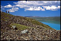 Backpackers on a ridge above Turquoise Lake. Lake Clark National Park, Alaska ( color)