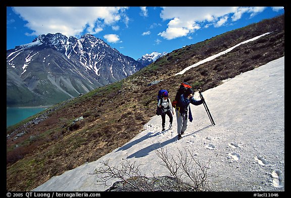 Backpackers crossing a neve. Lake Clark National Park, Alaska