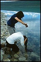 Backpackers cleaning up in Turquoise Lake. Lake Clark National Park, Alaska ( color)
