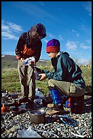 Backpackers transfering water. Lake Clark National Park, Alaska