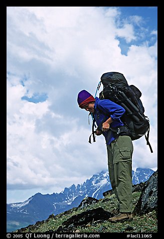 Woman backpacker with a large backpack. Lake Clark National Park, Alaska (color)