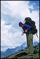 Woman backpacker with a large backpack. Lake Clark National Park, Alaska (color)