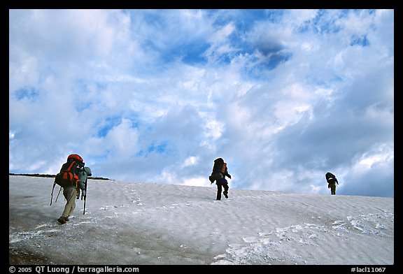 Backpackers crossing a neve. Lake Clark National Park, Alaska