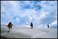 Backpackers crossing a neve. Lake Clark National Park, Alaska (color)