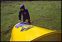 Backpacker drying gear on top of tent. Lake Clark National Park, Alaska (color)