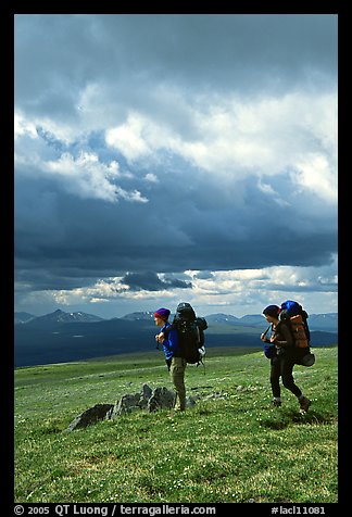 Backpackers seen from the side in the tundra. Lake Clark National Park, Alaska