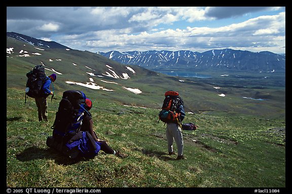 Backpackers take a pause when arriving on sight of Twin Lakes. Lake Clark National Park, Alaska