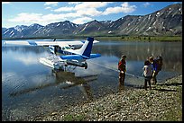 Backpackers being picked up by floatplane at Twin Lakes. Lake Clark National Park, Alaska