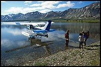 Backpackers being picked up by floatplane at Twin Lakes. Lake Clark National Park, Alaska (color)