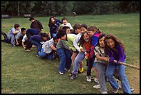 Children playing tug-of-war with a rope. Lake Clark National Park, Alaska (color)