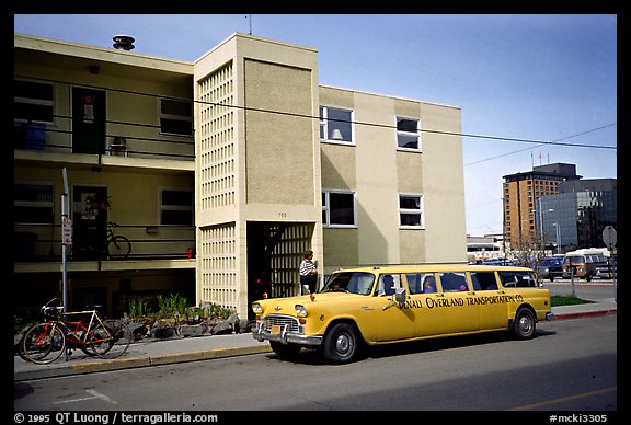 Denali overland shuttle in front of the Youth Hostel in Anchorage. Alaska (color)