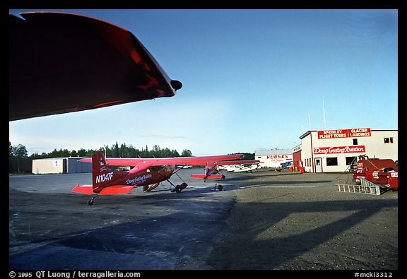 Planes fitted with both wheels and skis which can land on the glaciers. Alaska