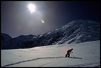 Probing a circle for crevasses, before unroping. Alaskan glaciers are among the biggest in the world, and have very deep crevasses, which are difficult to spot. Denali, Alaska (color)