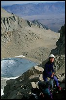 Woman gearing up to climb  East face of Mt Whitney. California ( color)