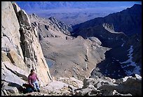 Man pausing on steep terrain in the East face of Mt Whitney. Sequoia National Park, California (color)