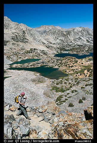 Hiker on trail above Saddlebag Lakes, John Muir Wilderness. Kings Canyon National Park, California (color)