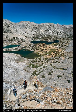 Hikers on trail above Saddlebag Lakes, John Muir Wilderness. Kings Canyon National Park, California (color)