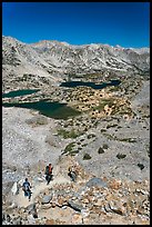 Hikers on trail above Saddlebag Lakes, John Muir Wilderness. Kings Canyon National Park, California (color)
