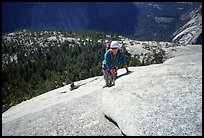 Rock climbers on the Snake Dike route, Half-Dome. Yosemite National Park, California (color)