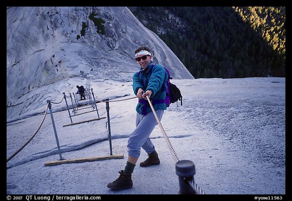 Hiker and cables on the regular route to Half-Dome. Yosemite National Park, California