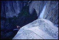 Climber near the top of Lost Arrow spire with Yosemite Falls behind. Yosemite National Park, California ( color)