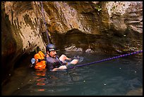 Canyoneer in pool of water, Mystery Canyon. Zion National Park, Utah ( color)