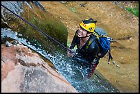 Canyoneer on rappel along waterfall. Zion National Park, Utah ( color)