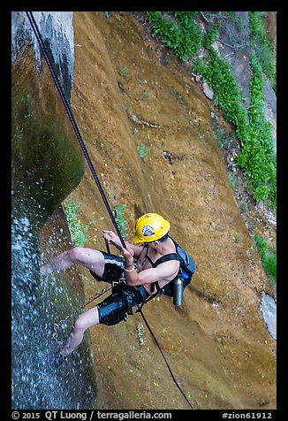 Man rappeling along waterfall. Zion National Park, Utah (color)