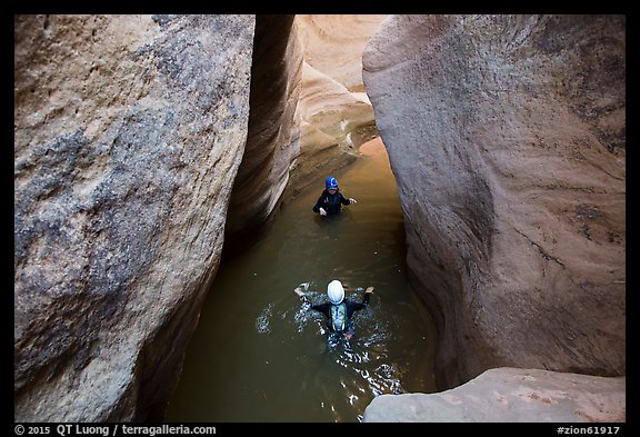 Canyoneers swim in Pine Creek Canyon. Zion National Park, Utah (color)