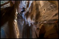 Woman rappels into chamber known as The Cathedral, Pine Creek Canyon. Zion National Park, Utah ( color)